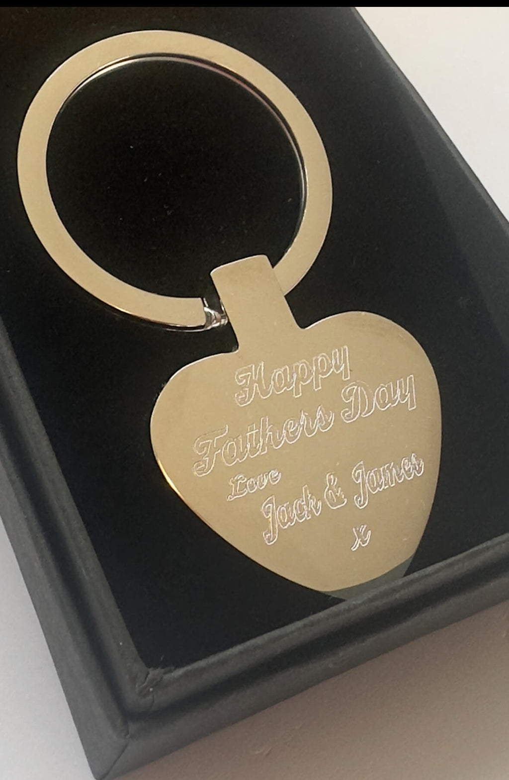 Gold keychain with 'Happy Father's Day' engraving in a black box