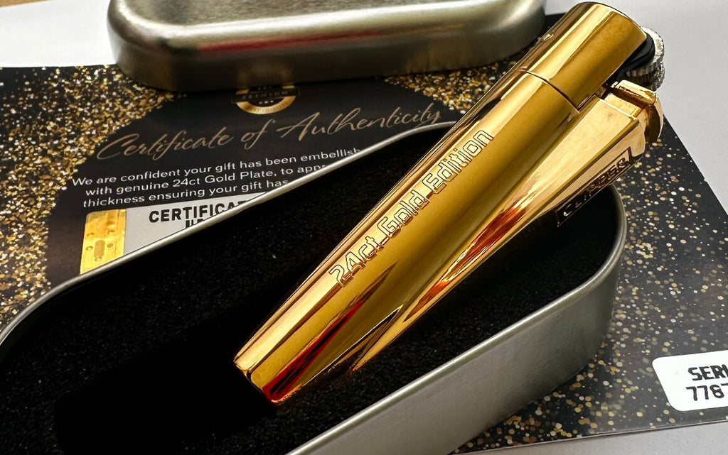 Gold pen with certificate of authenticity on a black and gold background